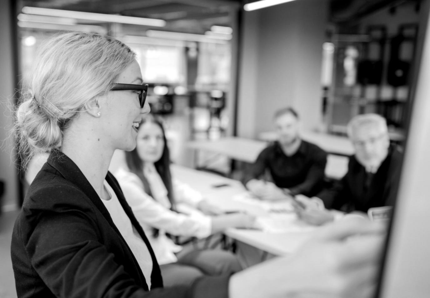 Students collaborating on financial planning exercises in modern learning environment